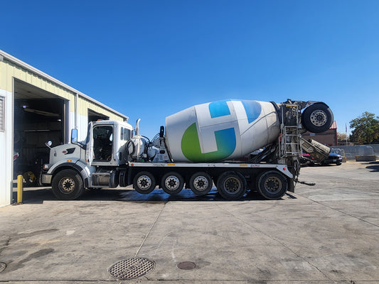 Concrete mixer truck undergoing maintenance at Western Mixer facility, highlighting service expertise