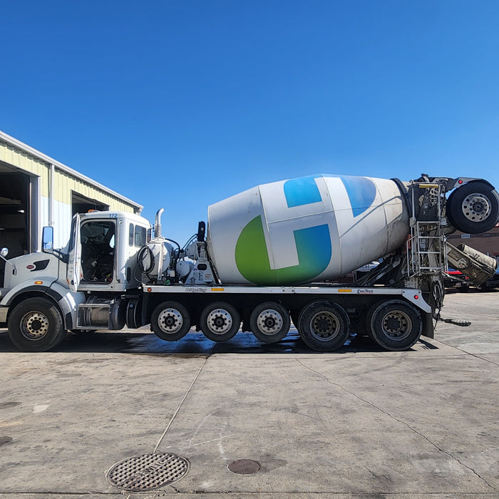 Concrete mixer truck undergoing maintenance at Western Mixer facility, highlighting service expertise