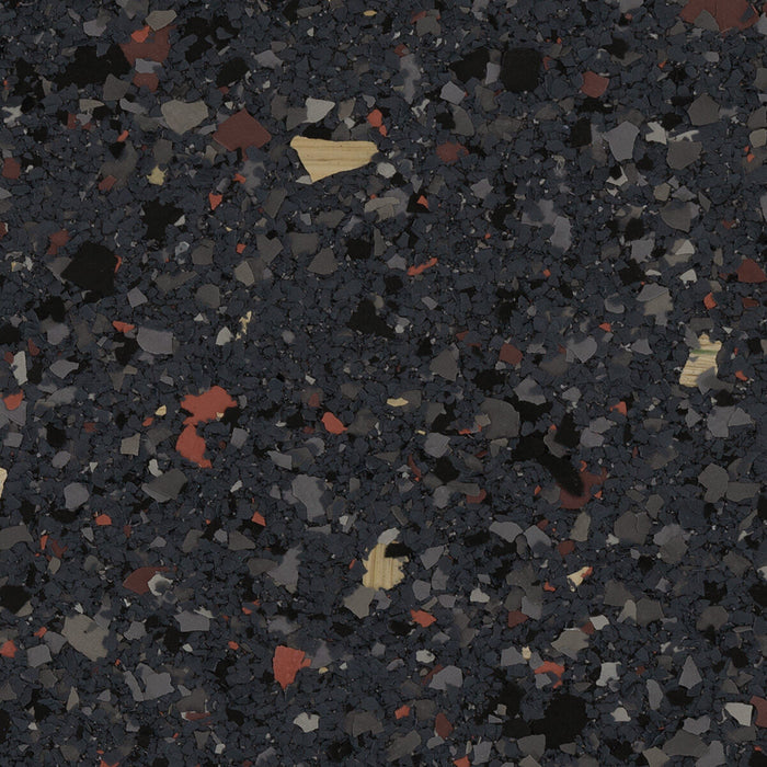 Blacktop epoxy flake – top view of hybrid-sized chips in black, gray, red, and yellow tones.